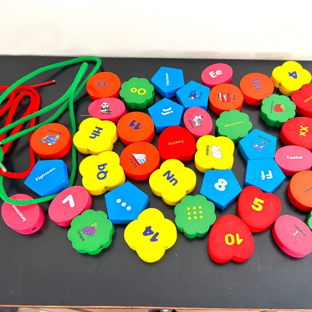 Wooden blocks for lacing; alphabet, numbers, colors;  set of 44